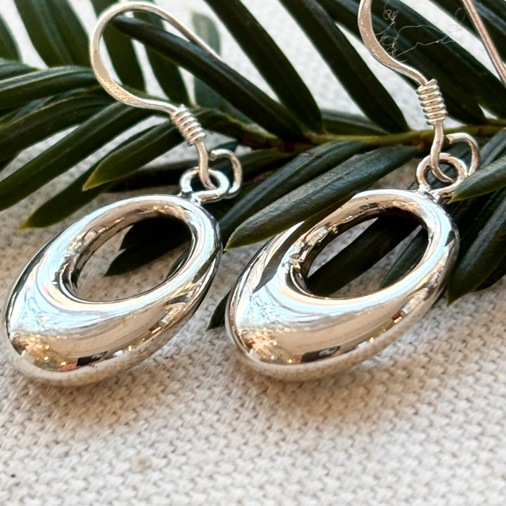 Polished sterling silver open oval drop earrings