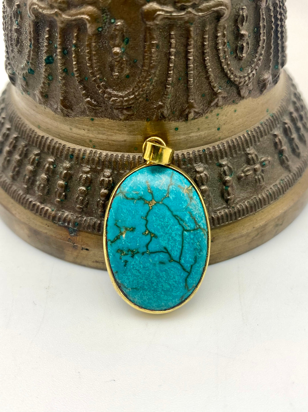 Held by the Blue Pendant