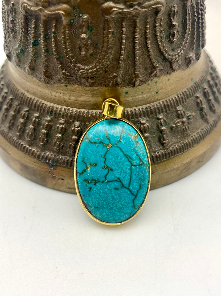 Held by the Blue Pendant