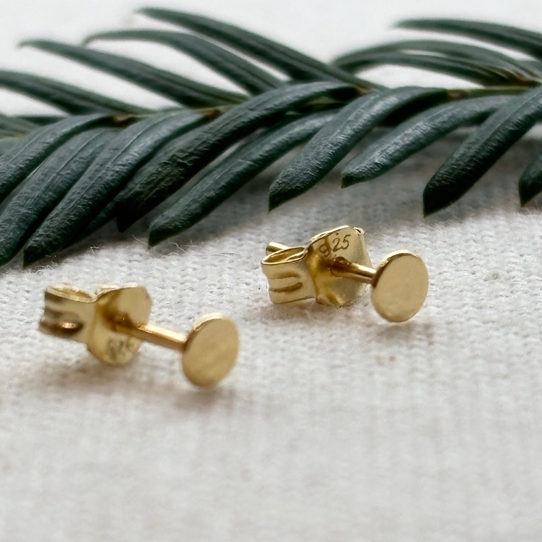 Gold plated sterling silver tiny disc stud earrings