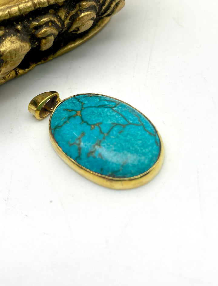 Held by the Blue Pendant