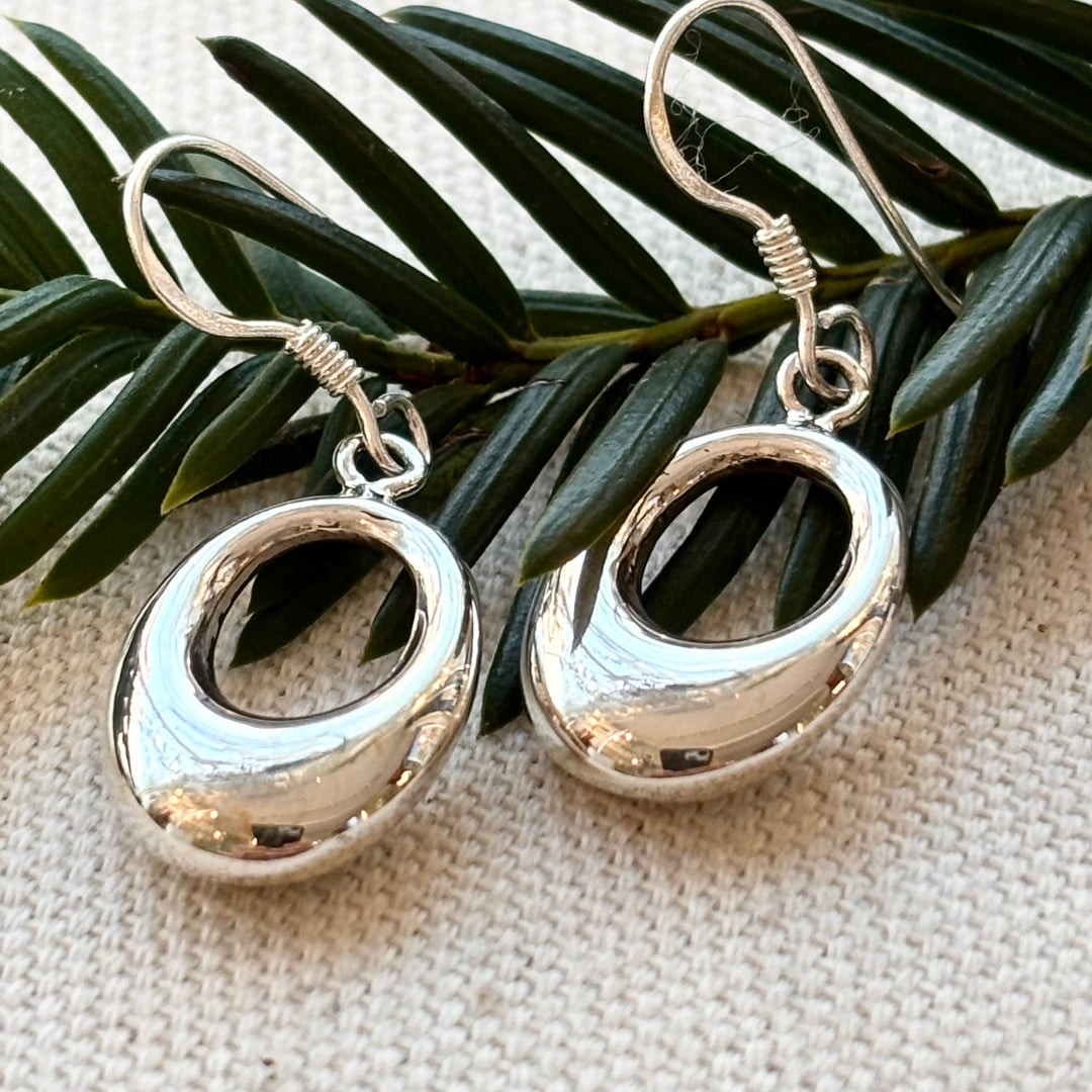 Polished sterling silver open oval drop earrings