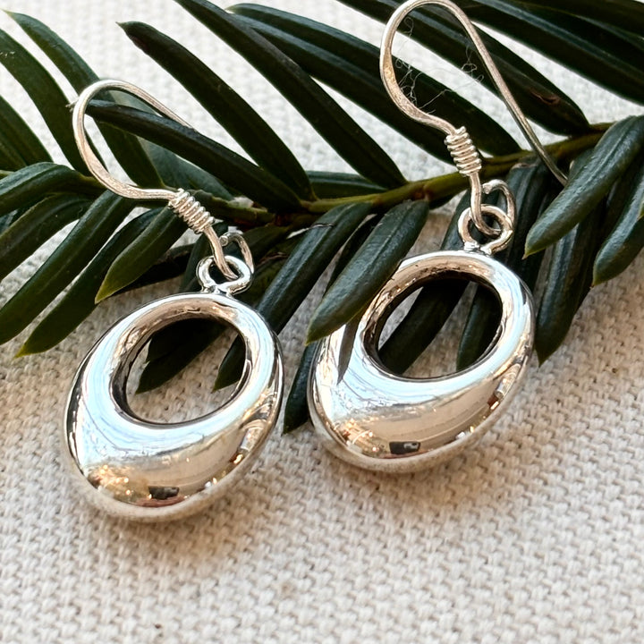 Polished sterling silver open oval drop earrings