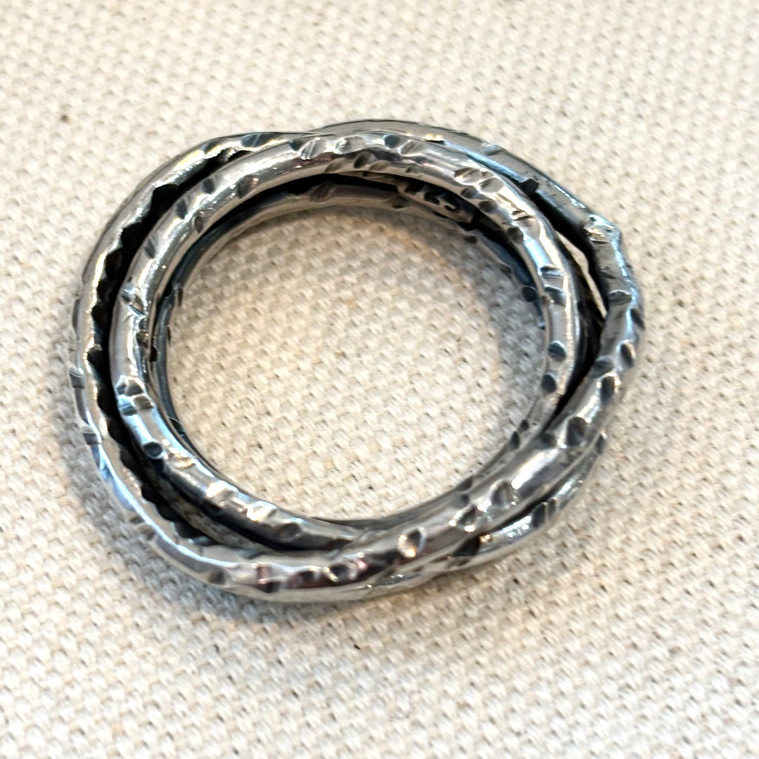 Hand textured woven sterling silver ring with layered wave form and organic surface finish